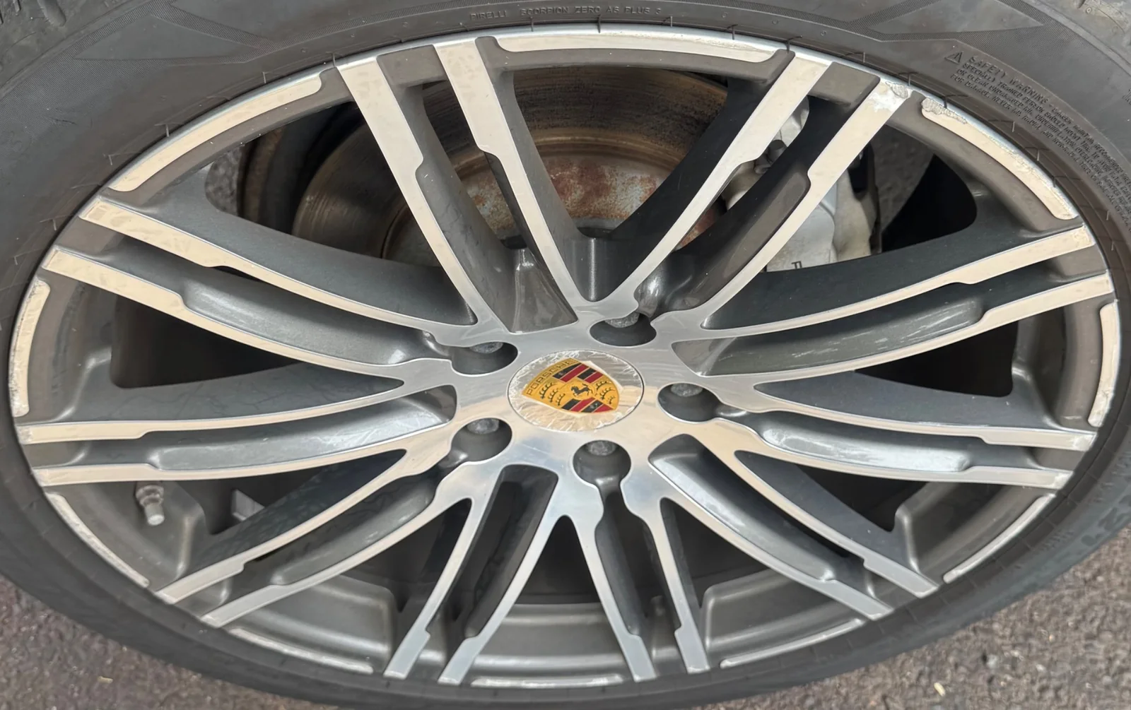 Porsche wheel before repair